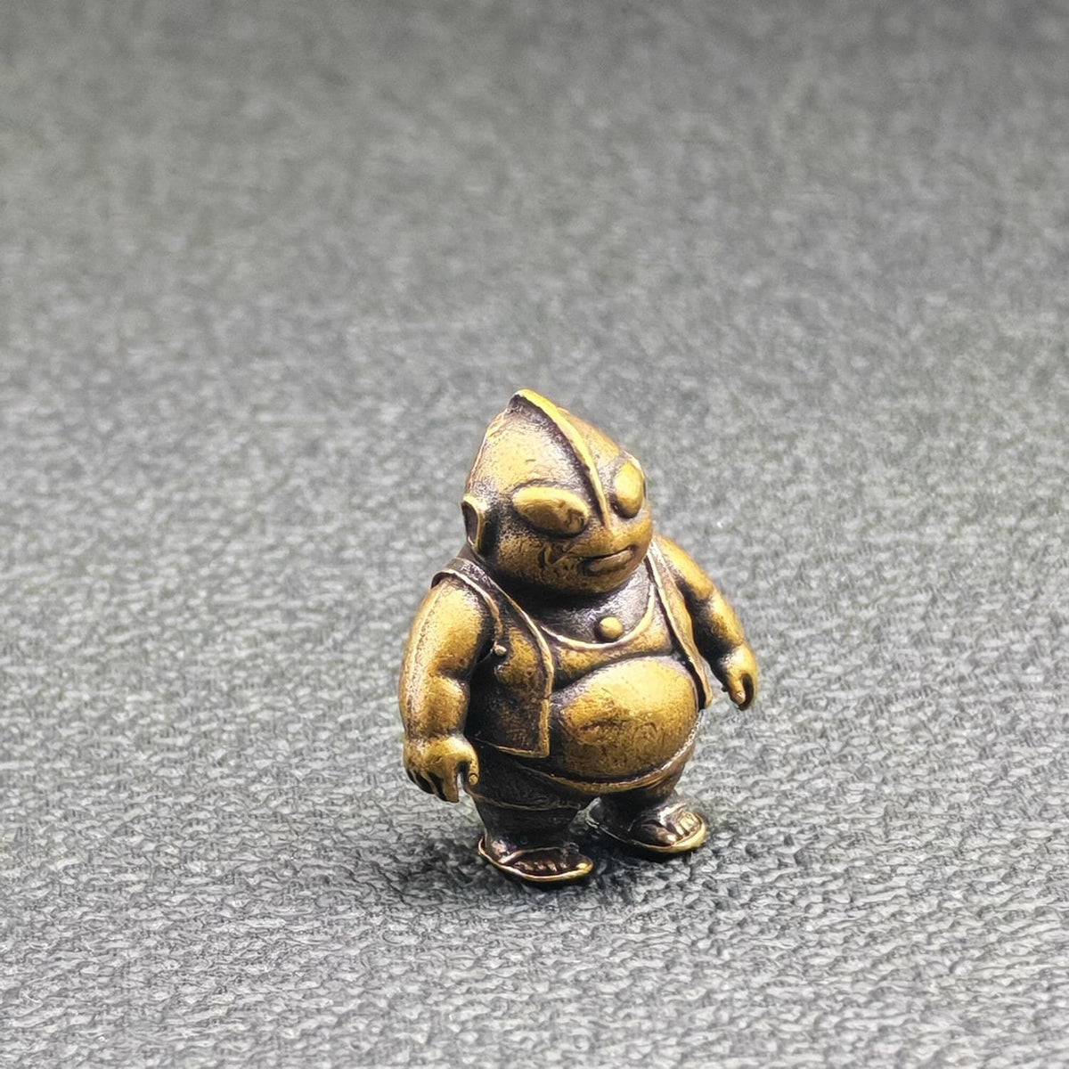 Brass Chubby Retired Hero Figurine — Parody Superhero Miniature & Novelty Desk Ornament