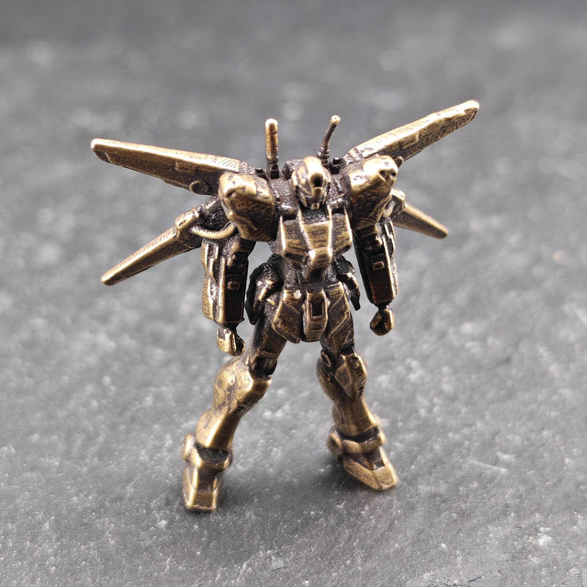 Brass Winged Mobile Suit Micro Figurine — Sci-Fi Mecha Diorama and Terrarium Sculpture
