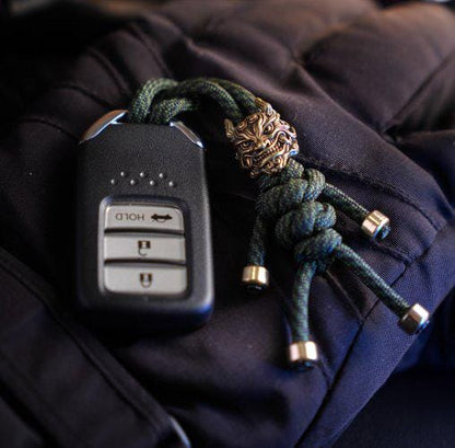 Brass Mythical Mask Paracord Keychain — EDC Backpack Charm & Car Ornament
