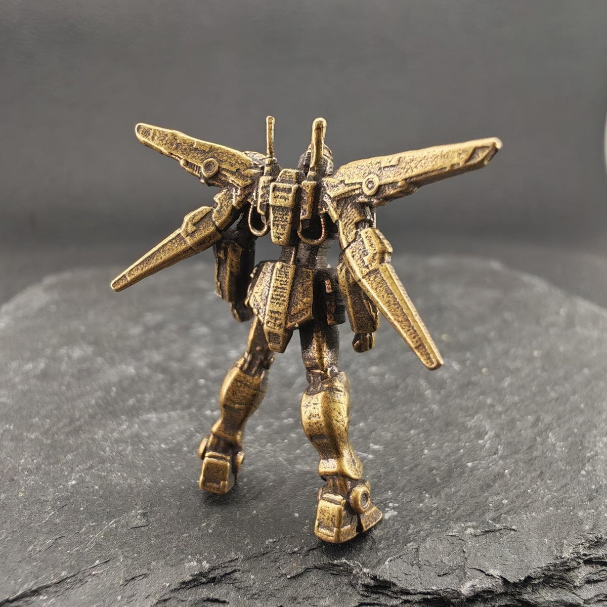 Brass Winged Mobile Suit Micro Figurine — Sci-Fi Mecha Diorama and Terrarium Sculpture