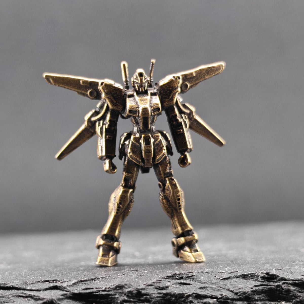Brass Winged Mobile Suit Micro Figurine — Sci-Fi Mecha Diorama and Terrarium Sculpture