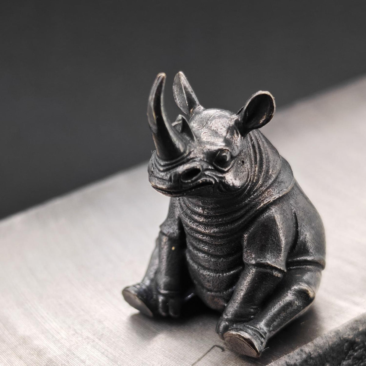 Daydreaming Rhino Brass Figurine – Meditating Animal Collectible Sculpture