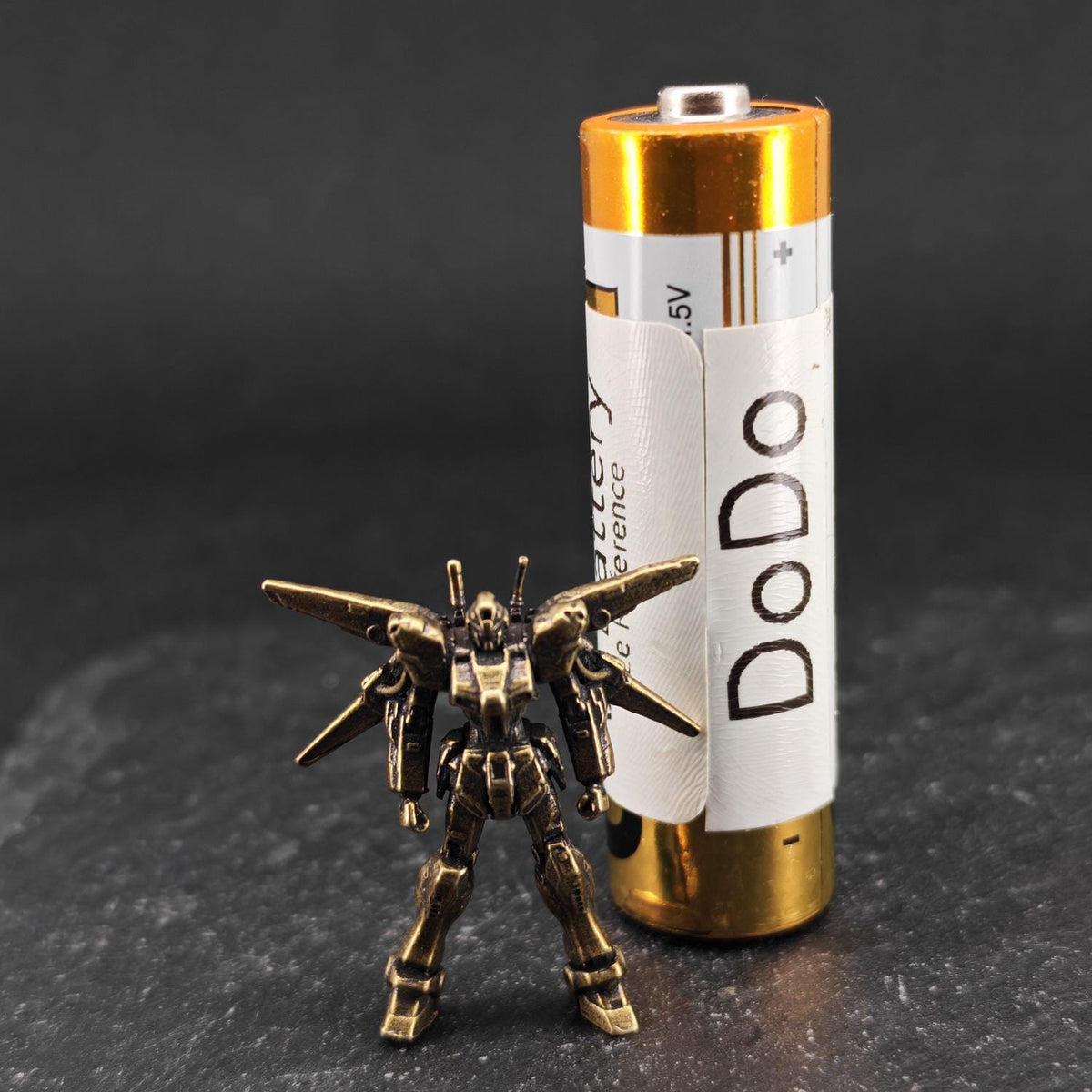 Brass Winged Mobile Suit Micro Figurine — Sci-Fi Mecha Diorama and Terrarium Sculpture