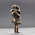 Lifted Off the Ground — Brass Kissing Couple Figurine