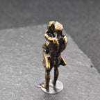Lifted Off the Ground — Brass Kissing Couple Figurine