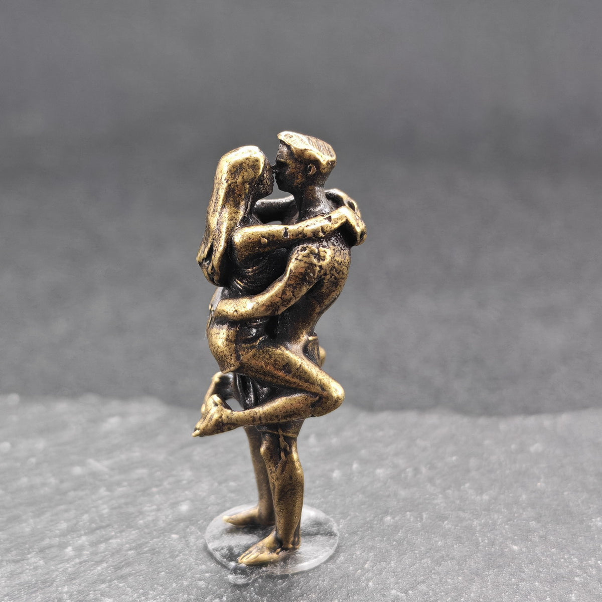 Lifted Off the Ground — Brass Kissing Couple Figurine