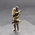Lifted Off the Ground — Brass Kissing Couple Figurine