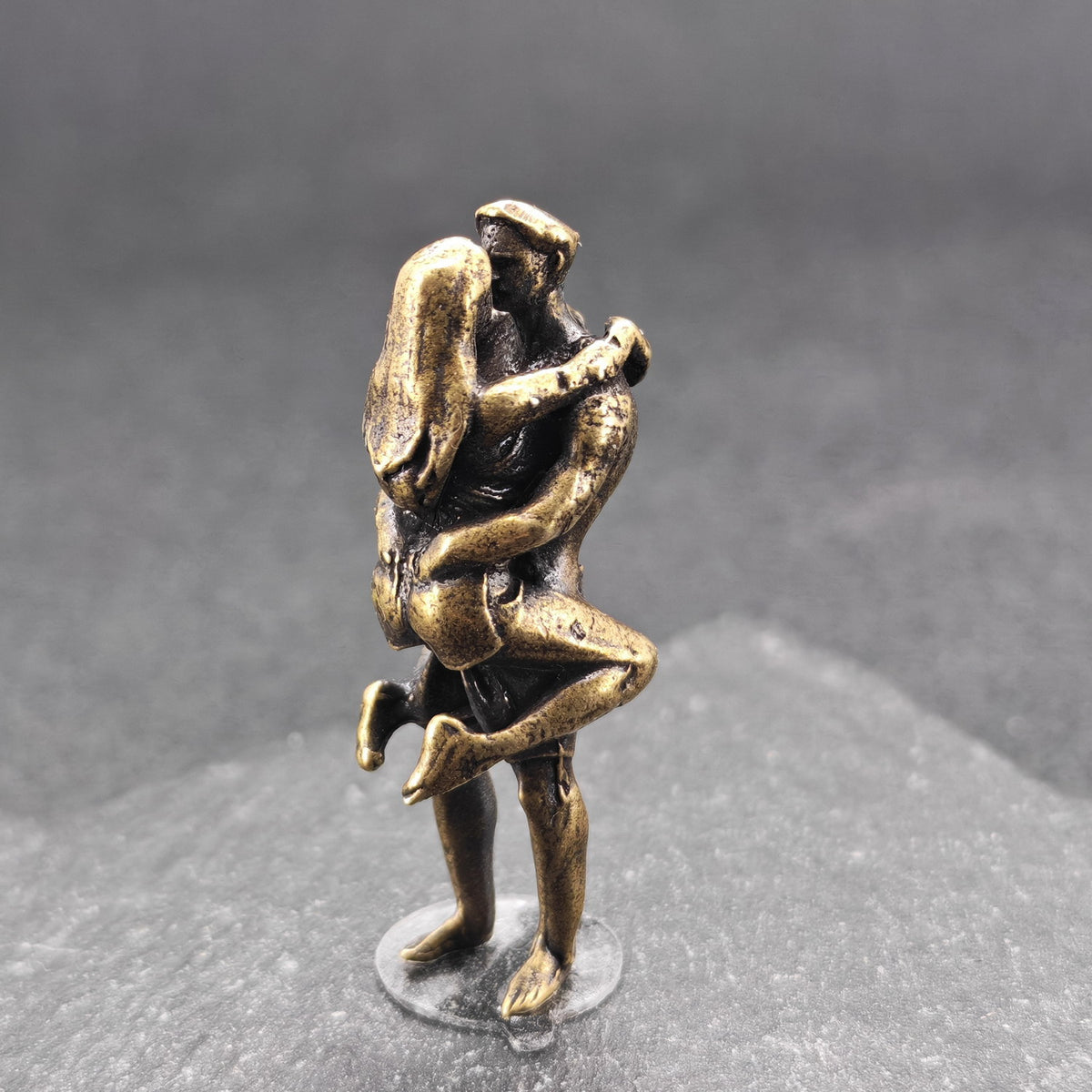 Lifted Off the Ground — Brass Kissing Couple Figurine