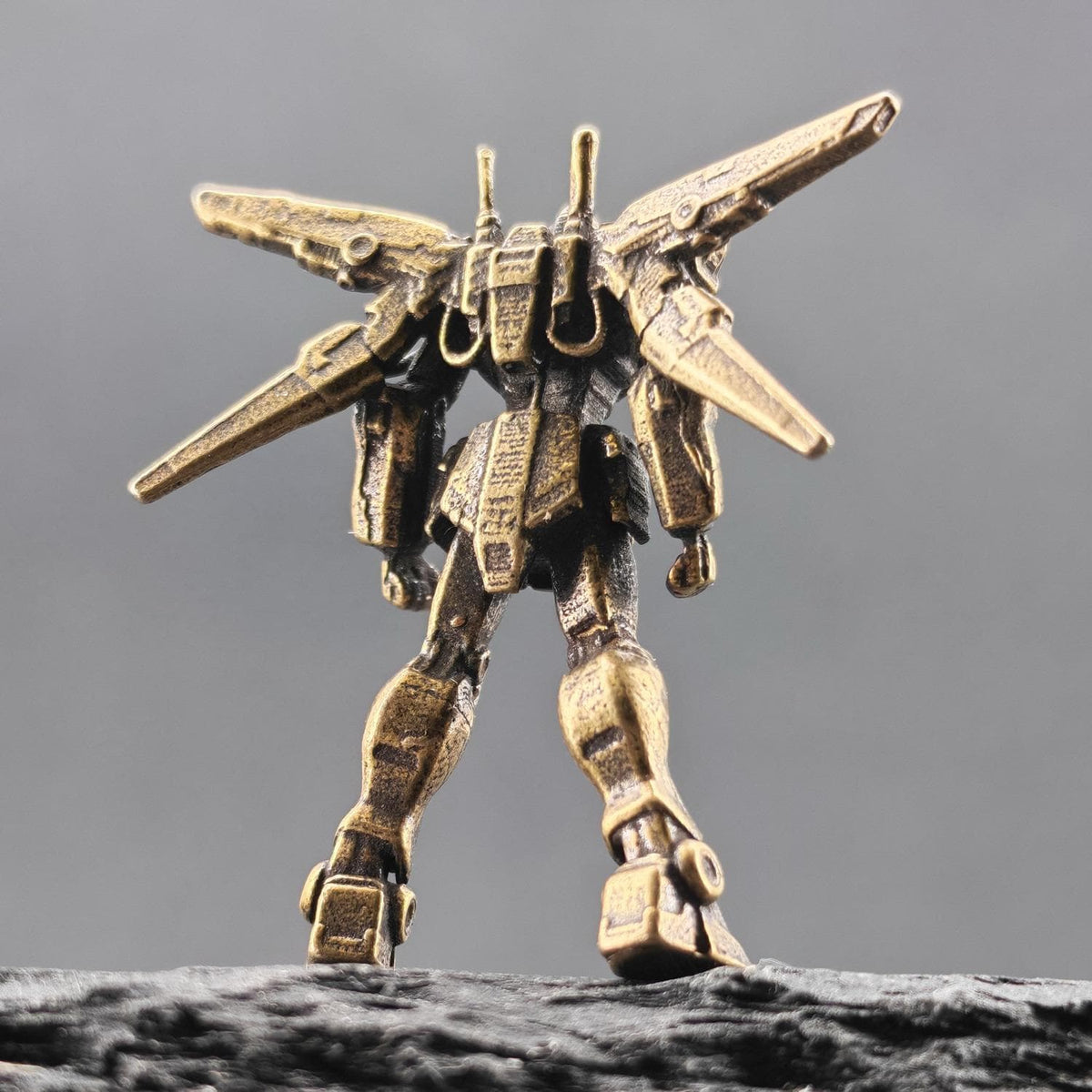 Brass Winged Mobile Suit Micro Figurine — Sci-Fi Mecha Diorama and Terrarium Sculpture