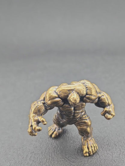 Brass Muscle Monster Figurine — Man Holding a Giant Brass Sculpture & Fantasy Desk Piece