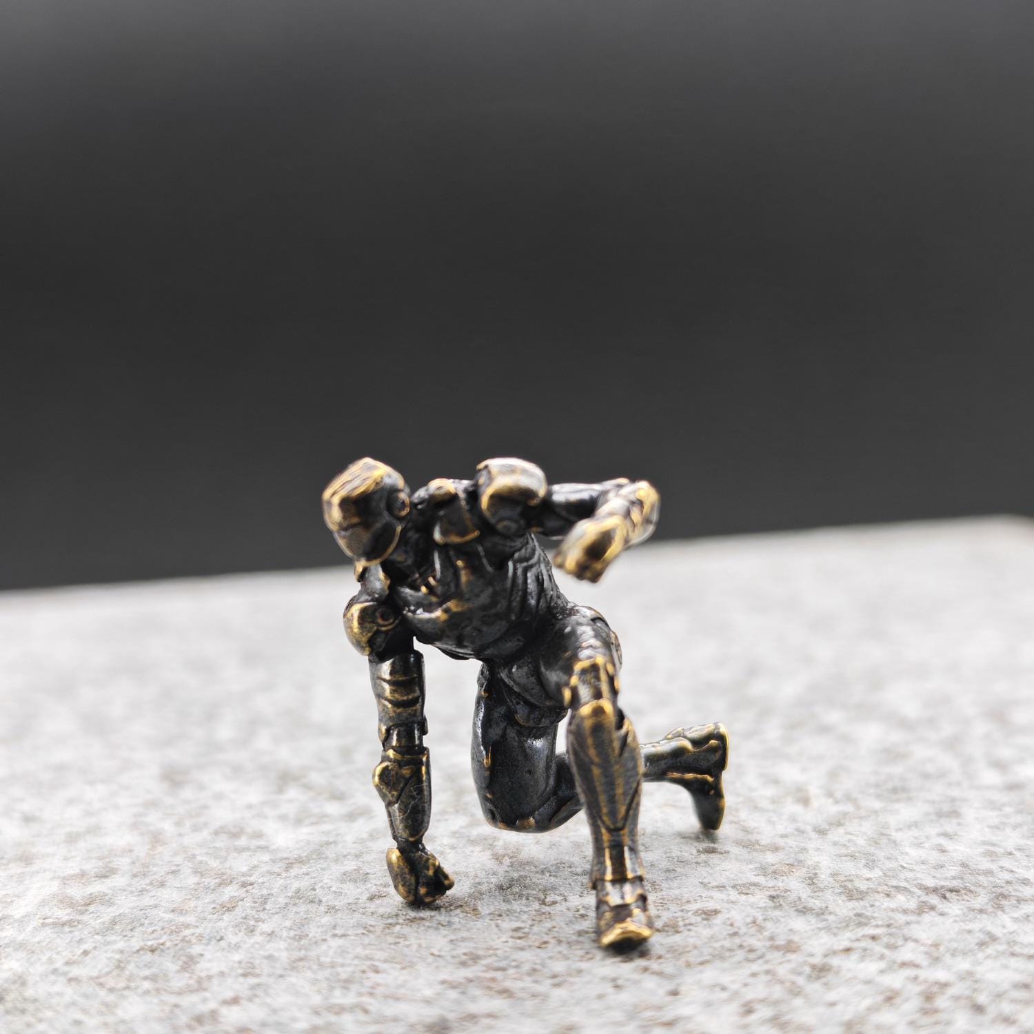 Brass Kneeling Armoured Hero Figurine — Red & Gold Exosuit Desk Collectible - Image 5