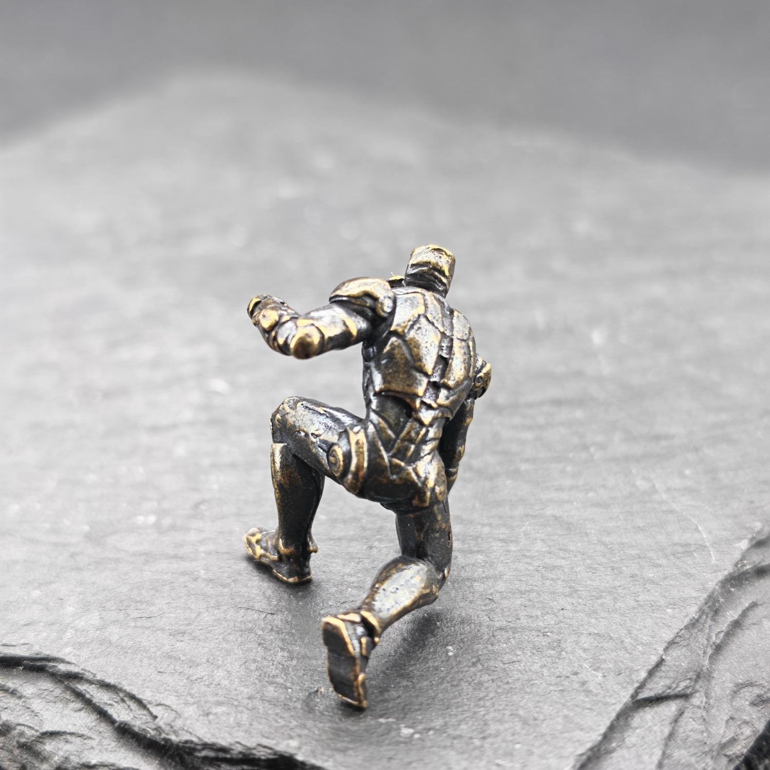Brass Kneeling Armoured Hero Figurine — Red & Gold Exosuit Desk Collectible - Image 7