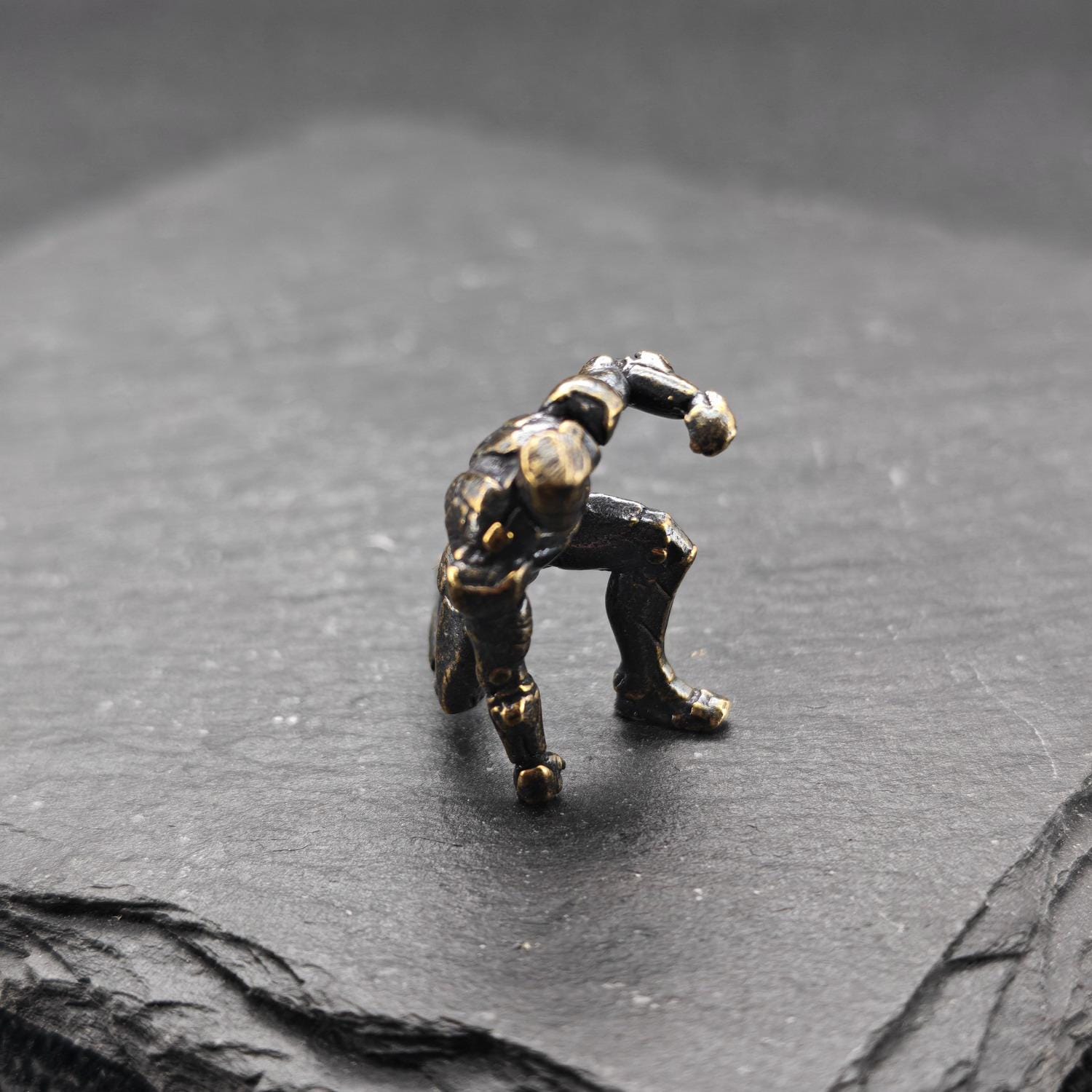 Brass Kneeling Armoured Hero Figurine — Red & Gold Exosuit Desk Collectible - Image 2