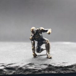 Brass Kneeling Armoured Hero Figurine — Red & Gold Exosuit Desk Collectible