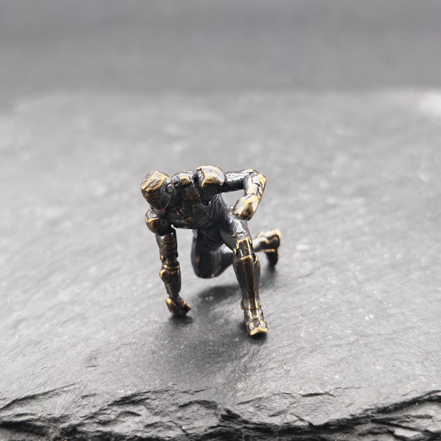 Brass Kneeling Armoured Hero Figurine — Red & Gold Exosuit Desk Collectible - Image 4